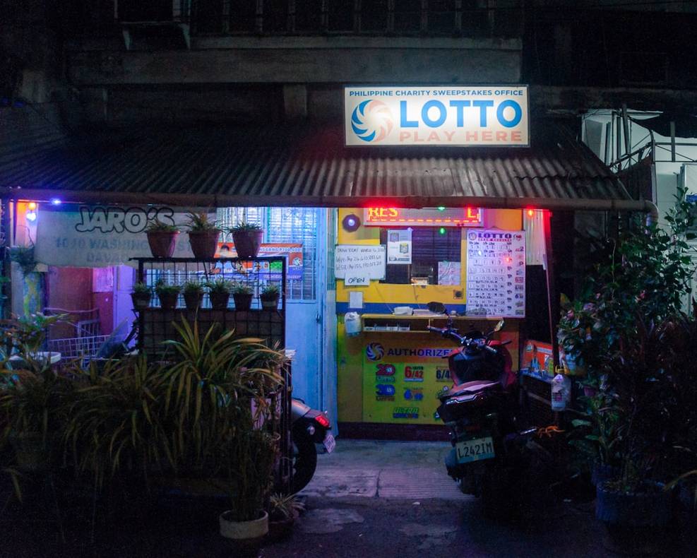 a lotto shop is seen at night tkIbFl5HzmE 22