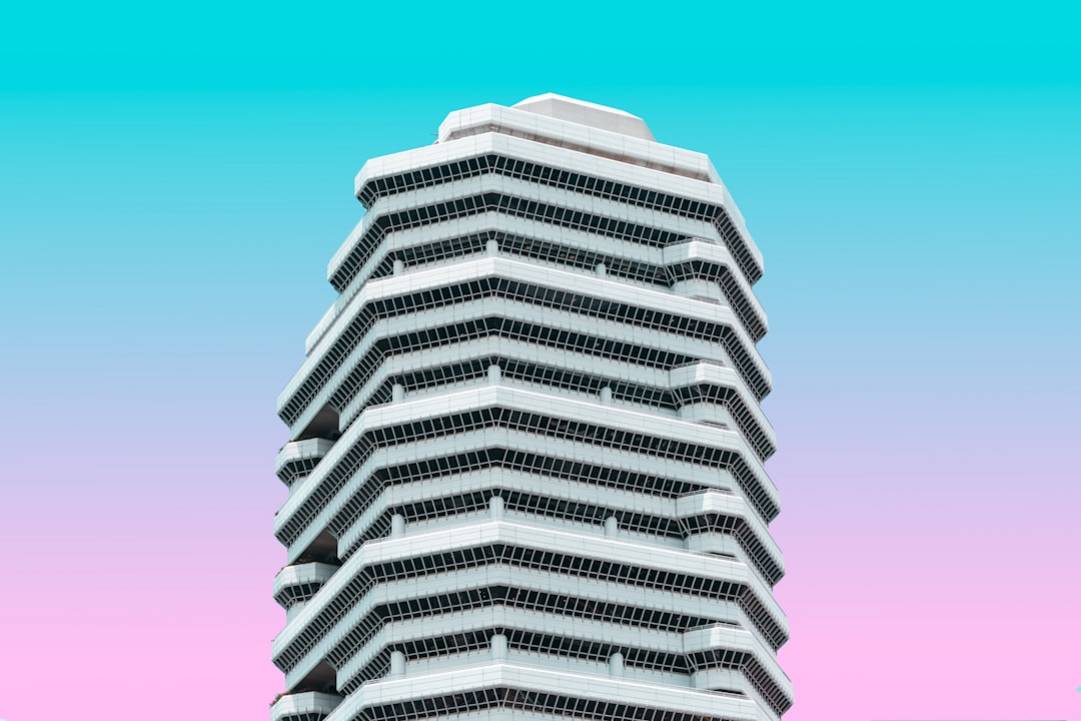 white concrete building under blue sky during daytime pa0joh4Vljc 1